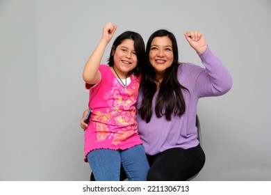 Latino Mom And Daughter Play, Dance, Surprise, Enjoy, Taking Selfies Using The Cell Phone Spending Quality Family Time