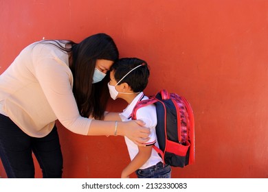 Latino Mom And Son Prepare To Go Back To School With A Backpack And Face Mask As Protection From Covid-19 In The New Normality Due To The Coronavirus Pandemic
