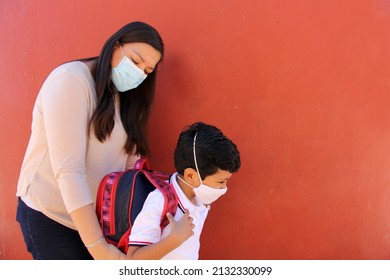 Latino Mom And Son Prepare To Go Back To School With A Backpack And Face Mask As Protection From Covid-19 In The New Normality Due To The Coronavirus Pandemic
