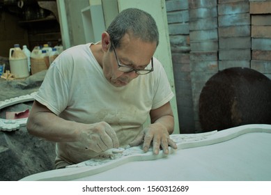 Latino Older Man Working The Wood Sitting