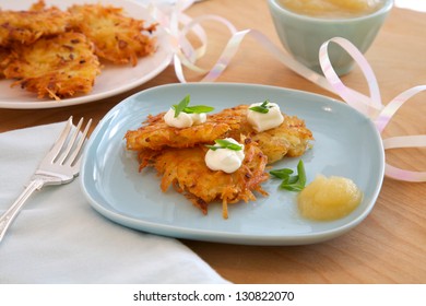 Latkes, Or Potato Pancakes With Applesauce, Sour Cream And Onions, Traditionally Served At Hanukkah