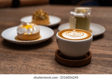 Latte art in cappuccino coffee cup at cafe table. Closeup of rosetta flower drawing in foam. hot latte coffee put on table in cafe restaurant or coffee shop, drink breakfast in the morning day - Powered by Shutterstock