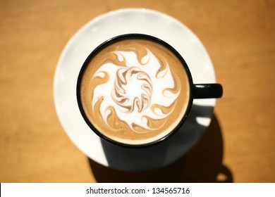 Latte Art, Designs drawn with steamed milk in hot fresh rich coffee in a ceramic coffee cup. - Powered by Shutterstock