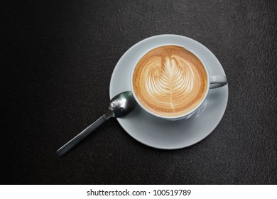latte art in white cup.