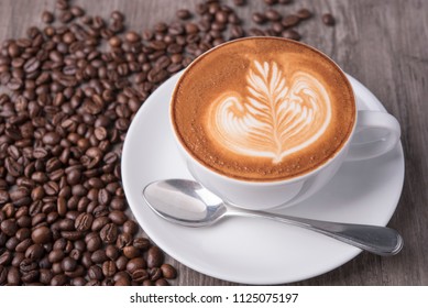 latte or Cappuccino with frothy foam, coffee cup top view on table in cafe. - Powered by Shutterstock