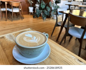 Latte in rustic ceramic cup in coffee shop - Powered by Shutterstock