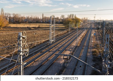 Lattice Train Tracks In Cargo Area At Sunset  