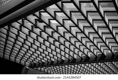 Latticed Sun Roof With Shadows And Open Sky Above In Black And White.
