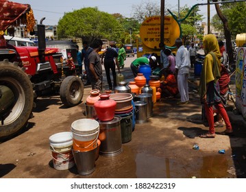 Latur, Maharashtra, India , April 07, 2016: Due To Severe Water Scarcity, Local Residents Fill Water In Huge Plastic Containers From A Water Tanker In Latur District, Maharashtra. India