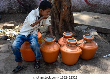 Latur, Maharashtra, India , April 07, 2016: Due To Severe Water Scarcity, Local Residents Fill Water In Huge Plastic Containers From A Water Tanker In Latur District, Maharashtra. India