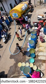 Latur, Maharashtra, India , April 07, 2016: Due To Severe Water Scarcity, Local Residents Fill Water In Huge Plastic Containers From A Water Tanker In Latur District, Maharashtra. India