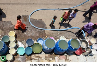 Latur, Maharashtra, India , April 07, 2016: Due To Severe Water Scarcity, Local Residents Fill Water In Huge Plastic Containers From A Water Tanker In Latur District, Maharashtra. India