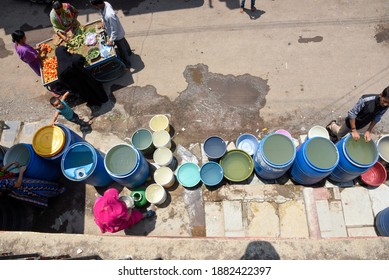 Latur, Maharashtra, India , April 07, 2016: Due To Severe Water Scarcity, Local Residents Fill Water In Huge Plastic Containers From A Water Tanker In Latur District, Maharashtra. India