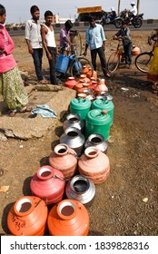 Latur, Maharashtra, India/April 07, 2016: Due To Severe Water Scarcity, Local Residents Fill Water In Huge Plastic Containers From A Water Tanker In Latur District, Maharashtra. India