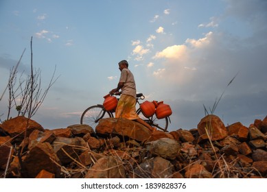 Latur, Maharashtra, India/April 07, 2016: Due To Severe Water Scarcity, Local Residents Fill Water In Huge Plastic Containers From A Water Tanker In Latur District, Maharashtra. India