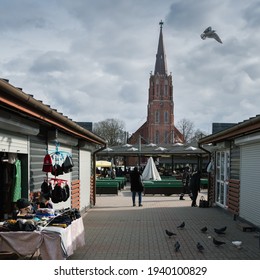 LATVIA, LIEPAJA - 18 MARCH: Liepaja is a city located on the Baltic Sea. View to the market place and church on 18 March 2021, Liepaja, Latvia. - Shutterstock ID 1940100829