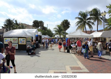 LAUDERDALE-BY-THE-SEA, FLORIDA - OCTOBER 28: Many people shopping at the outdoor annual craft festival where local artists display outside on October 28, 2012 in Lauderdale-by-the-Sea, Florida.