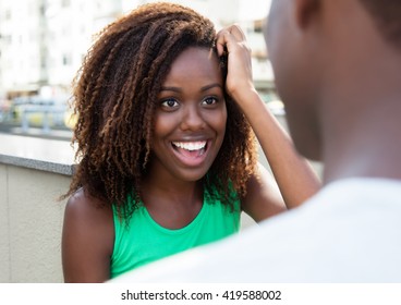 Laughing African Girl Flirting With Friend