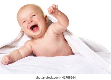 laughing baby 4 month old under towel