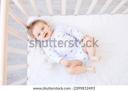 Similar – Image, Stock Photo Baby lying on his back as his doctor examines him during a standard medical checkup
