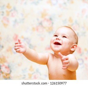 Laughing Baby Looks Up And Hands Up