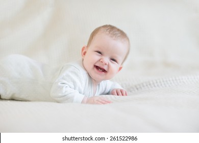 Laughing Baby On Bed