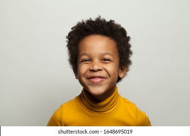 Laughing black child boy on white background - Powered by Shutterstock