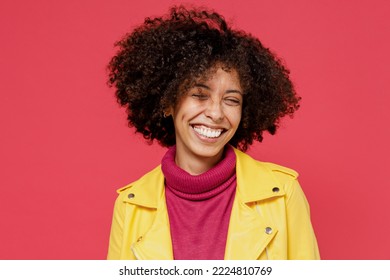 Laughing Bright Happy Fun Young Curly Black Latin Woman 20s Years Old Wears Yellow Jacket Keep Eyes Closed Smiling Isolated On Plain Red Background Studio Portrait. People Emotions Lifestyle Concept