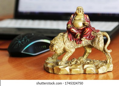 laughing buddha on the Desk in the office, Feng Shui so close