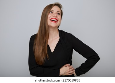 Laughing Business Woman Or Office Worker In Black Suit Holding Hands On Hip And Looking Away, Isolated Female Portrait.