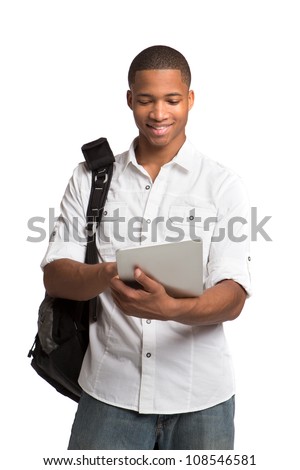 Laughing Casual Young Black Man Holding a Touch Pad Tablet PC on Isolated White Background