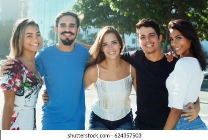 Laughing Caucasian And Latin And Hispanic People In Arms