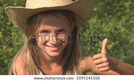 Laughing Child Relaxing Outdoor on Grass, Happy Girl Face Portrait in Nature