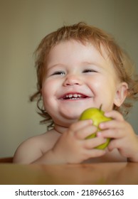 Laughing Cute Child Eating Apple Fruit, Portrait On Blurred Background. Enjoy Eating Moment. Healthy Food And Kid Concept. Funny Child Face Closeup.