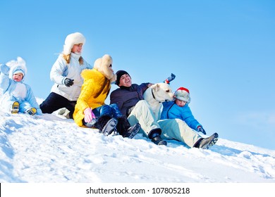 Laughing Family And Labrador Retriever Dog In Winter Park