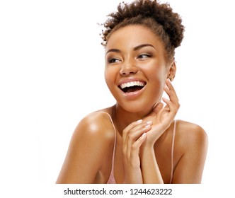 Laughing girl with flawless skin. Photo of african american girl on white background. Youth and skin care concept