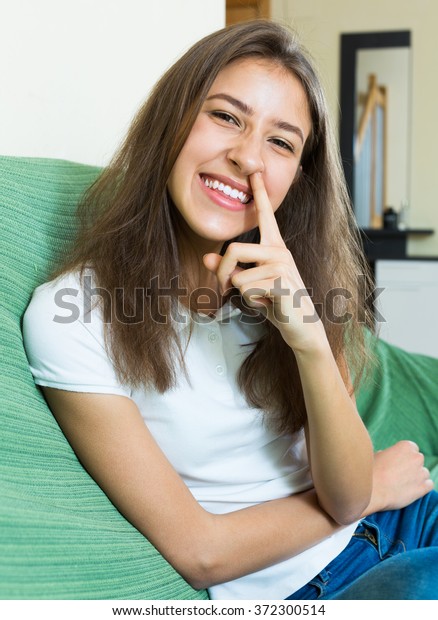 Laughing Girl Sitting On Couch Finger写真素材372300514 Shutterstock 8012