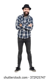 Laughing Hipster Wearing Fedora Black Hat With Crossed Arms Looking At Camera. Full Body Length Portrait Isolated Over White Studio Background.