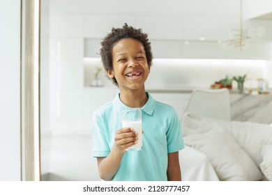 Laughing Kid Boy Drinking Milk At Home