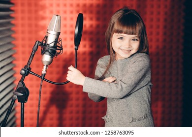 Laughing Kid Standing Near The Microphone And Posing To The Camera. Hobby, Entertainment Concept