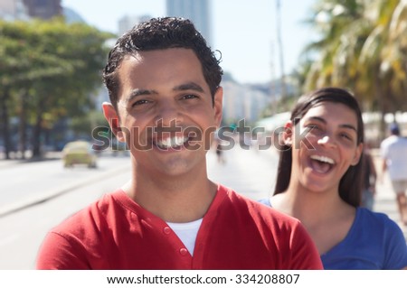 Laughing latin couple in the city