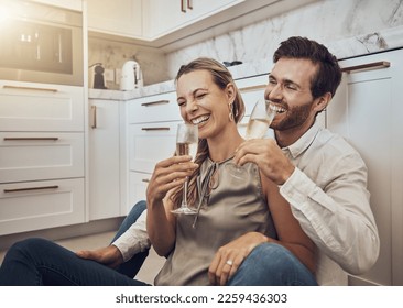 Laughing, love and couple with champagne in the kitchen for celebration, anniversary and valentines day. Comic, relax and funny man and woman drinking alcohol on the floor with happy conversation - Powered by Shutterstock