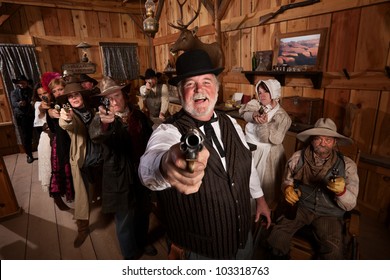 Laughing Man With Old West Gang Point Guns In A Saloon