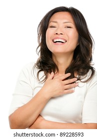 Laughing Mature Middle Aged Asian Woman Joyful And Cheerful. Chinese Asian Woman In Her Early Fifties Isolated On White Background.