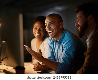 Laughing, meeting and business people in office at night for planning, teamwork and collaboration. Happy, creative agency and men and women on computer for online project, website and research - Powered by Shutterstock