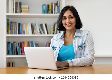 Laughing Mexican Mature Adult Woman At Computer At Home