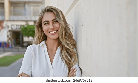 Laughing out loud, vivacious young blonde woman, confidently standing with her arms crossed in an urban street, radiating healthy joy and a contagious smile. - Powered by Shutterstock