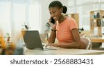 Laughing, phone call or black woman with laptop, research or smile networking online in office. Digital agency, email or happy African employee talking about news, ideas or planning in tech startup