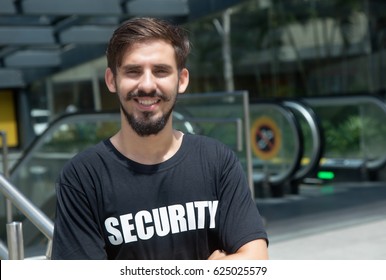 Laughing security guard safes the entrance