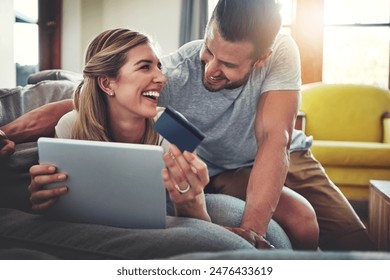 Laughing, tablet or happy couple with credit card in home for ecommerce sale, fintech web or order choice. Funny joke, easy payment or people with financial app, online shopping or internet banking - Powered by Shutterstock